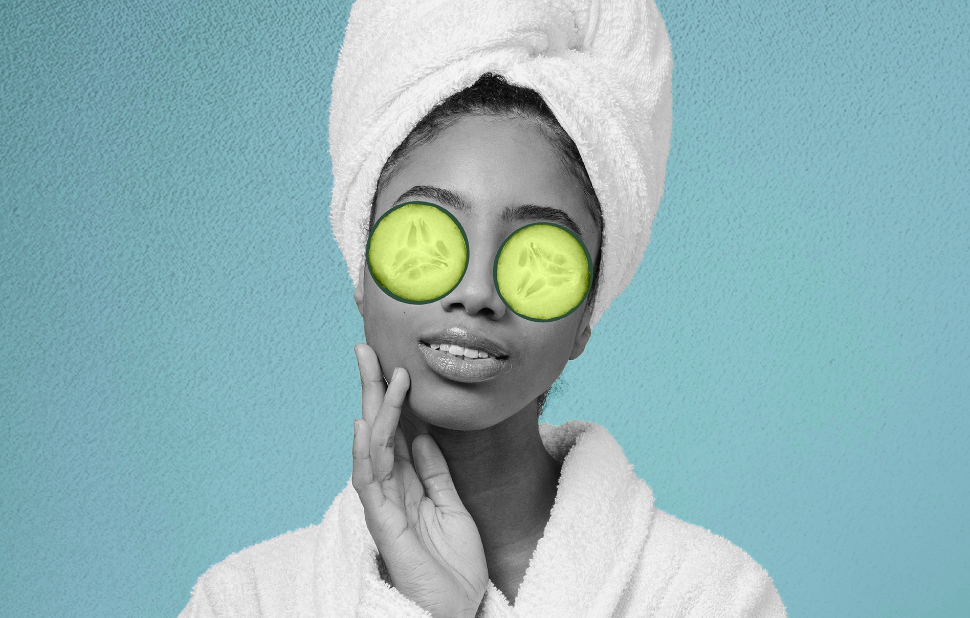Person in a robe and head towel wearing cucumber slices on their eyes